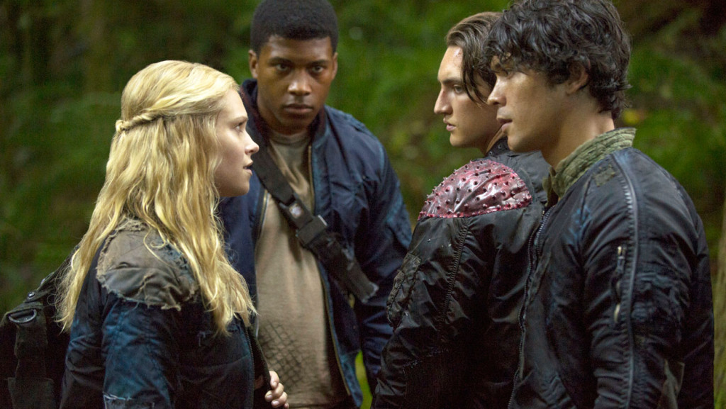 The 100 -- "Earth Skills" -- Image: HU102b_0576 -- Pictured (L-R): Eliza Taylor as Clarke, Eli Goree as Wells, Richard Harmon as Murphy, and Bob Morley as Bellamy -- Photo: Cate Cameron/The CW -- © 2014 The CW Network, LLC. All Rights Reserved.